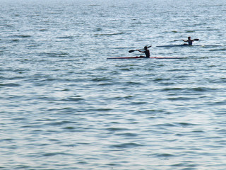 Young men float on the kayaking