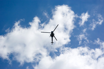 Fototapeta na wymiar Sky with helicopter in center