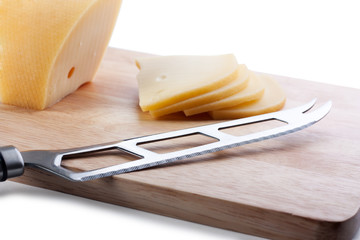 Cheese knife on cutting board