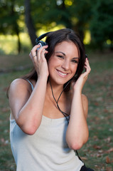 Girl listening music in the park