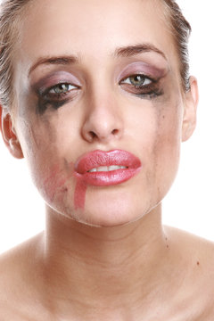 Portrait Of A Crying Woman With Flowing Mascara And Lipstick