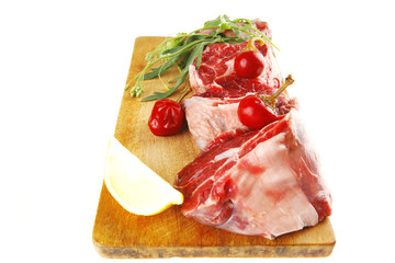 raw beef medallion on wood