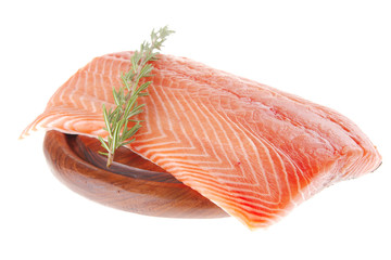 salmon fillet on wood plate and rosemary