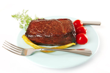 meat and vegetables on blue