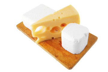 cheeses on wooden board