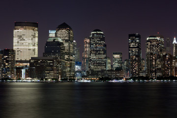 Financial District Manhattan at Night over Hudson river