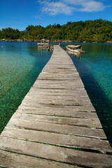 Wooden jetty over tropical beach