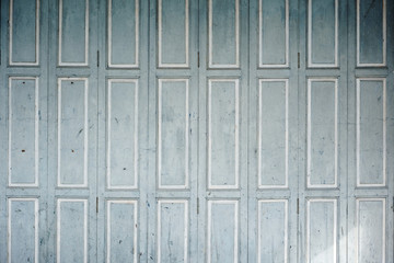 Faded blue-grey wooden shutters