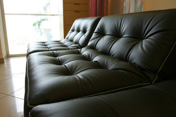 Black leather sofa in office