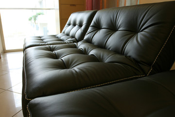 Black leather sofa in office