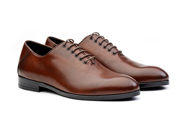 Pair of brown male classic shoes on white background