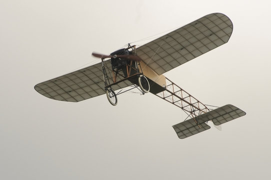 Vintage aircraft Bleriot XI in the air.