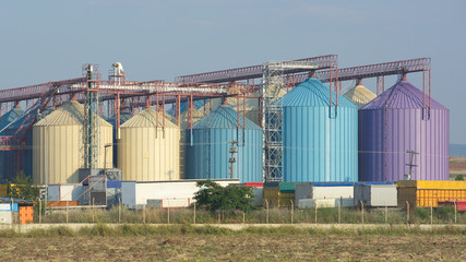 Fototapeta na wymiar row of multi colored silos