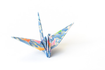 An origami bird with birds-pattern on a white background.