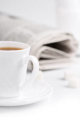 coffee, sugar and stack of newspapers