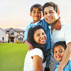 Happy Family Embracing in Front of House