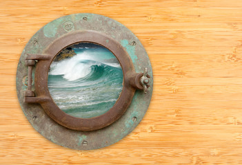 Antique Porthole with View of Crashing Waves on a Bamboo Wall Ba