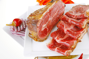 served meat chunk with rolls  on white