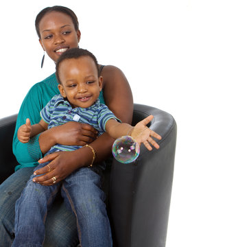 Young afro american family with bubbles