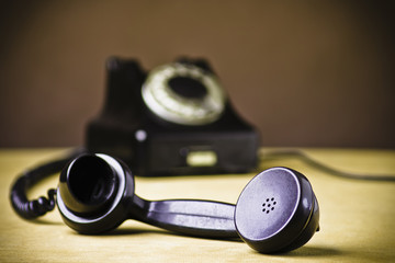 Vintage Rotary Dial Telephone. Soft focus with focus on handset.