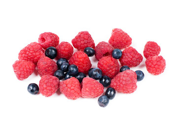 Raspberries and bilberry on white background