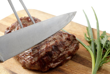 roasted meat on a cutting board. isolated object
