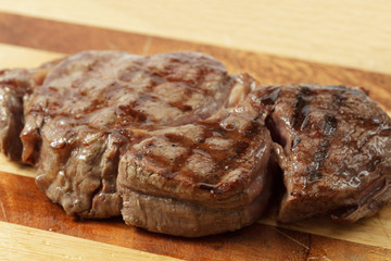 roasted meat on a cutting board. isolated object