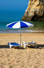 Two chairs and umbrella at the beach