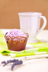 cupcake with lavender icing top in festive wrap and mug