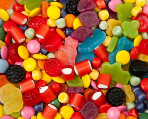 Fototapeta na wymiar Different colourful candies for background