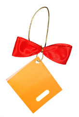 Red bow on a gold lace with a yellow tag