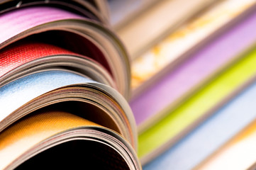 Stack of open magazines