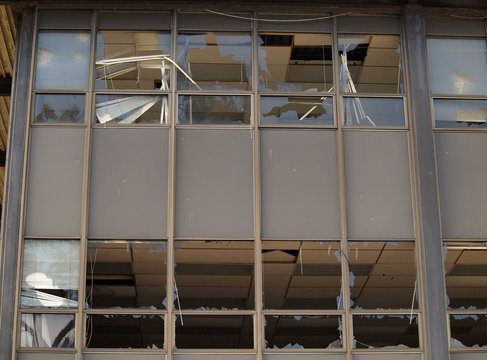 Broken windows of an office building