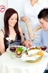 Happy couple having dinner at the restaurant