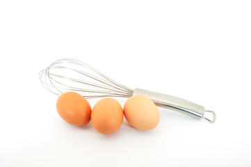 whisk with three eggs