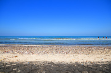 seashore with waves and foam