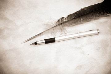 image of feather and pen