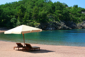 Empty chairs and umbrella