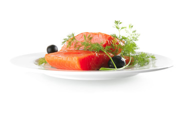 pink salmon on white plate with olives