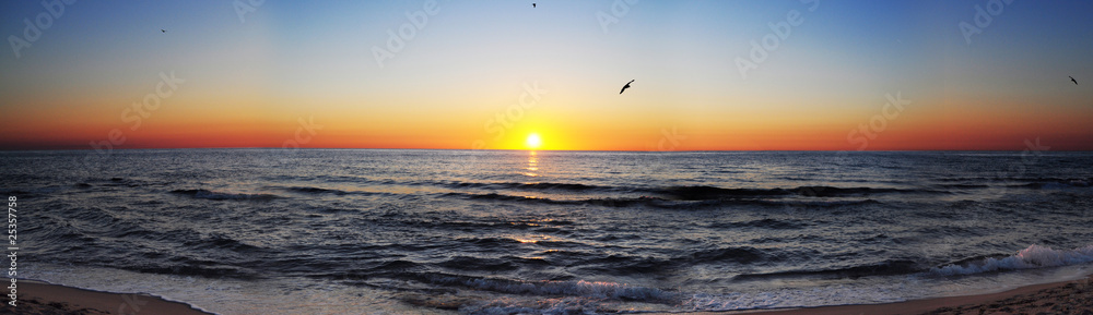 Wall mural sunrise at sea panorama