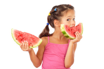 Little girl eating two slices of watermelon, studio shoot