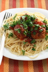 spaghetti with meatballs and parsley