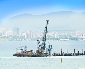 Obraz premium sea port cranes with blue cloudy sky