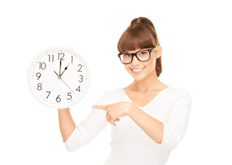 woman holding big clock