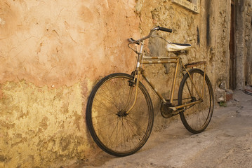 old bicycle at a wall