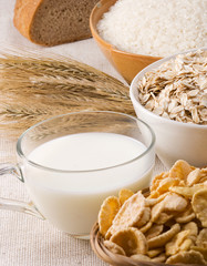 milk, oat, rice and bread on sack