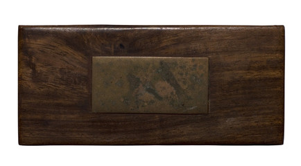 Wood panel with aged brass plaque