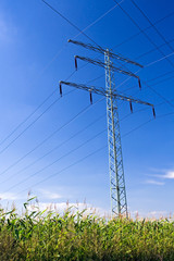 Power lines over blue sky