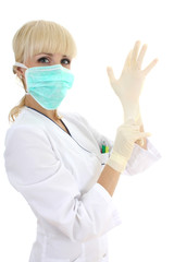 surgeon woman in mask and rubber gloves over white