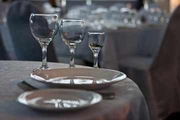 Glasses and plates on table